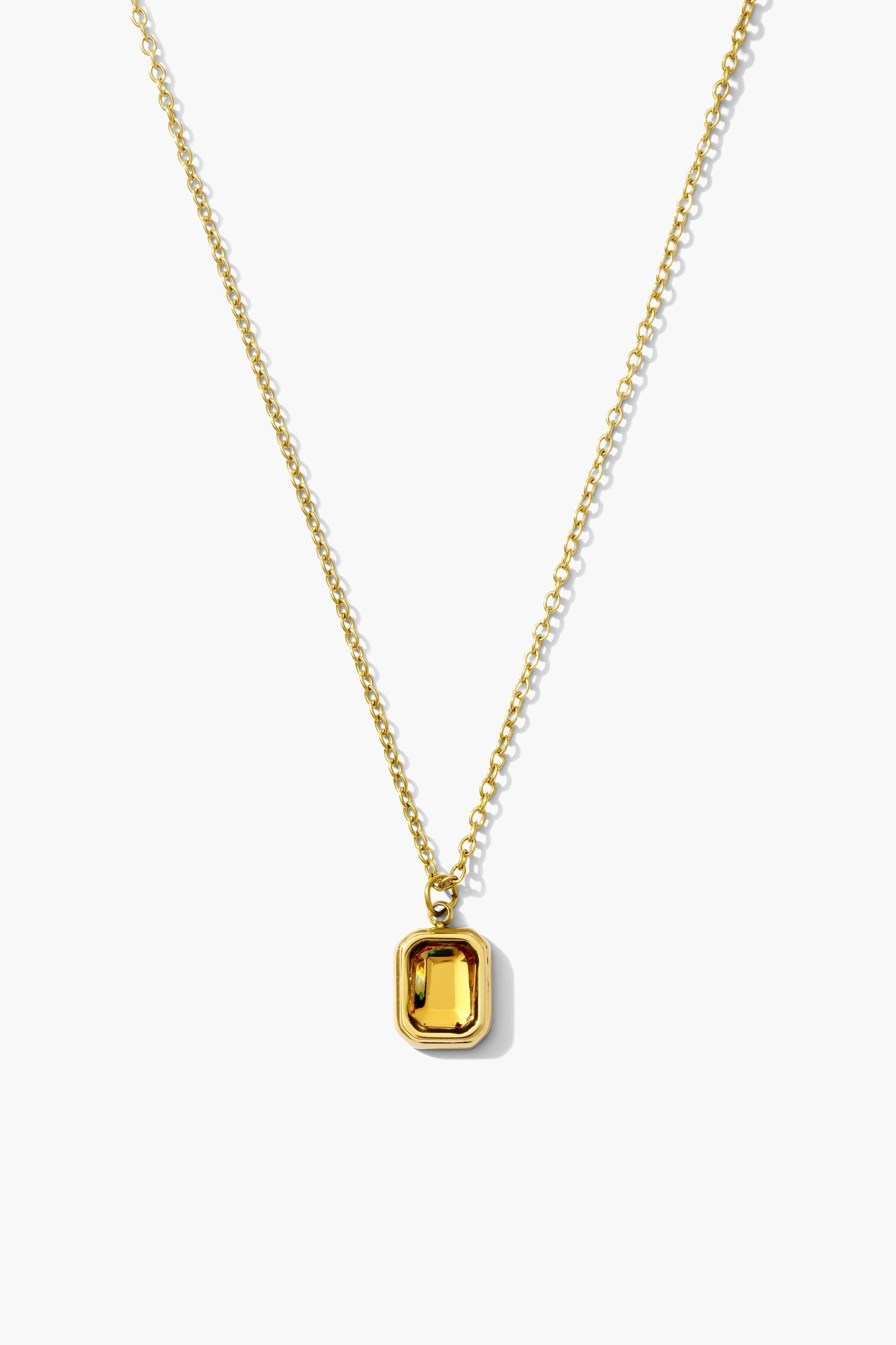 November citrine birthstone necklace, golden yellow emerald-cut stone on an 18K gold plated chain